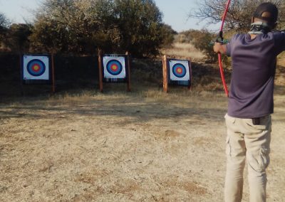 Man Shooting Archery Targets